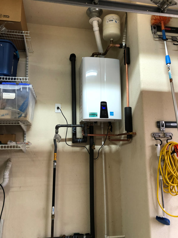 photo of a tankless water heater that was installed to replace an older tanked unit.